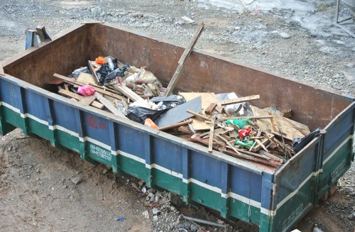 Business team handling sofa waste removal