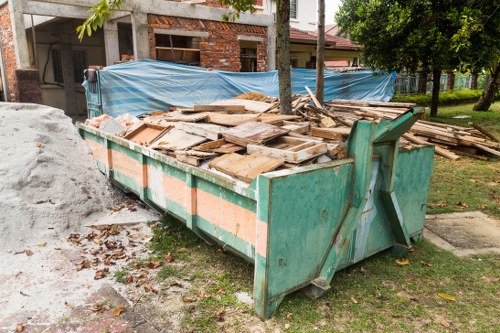 Professionals handling sofa removal in Goodmayes