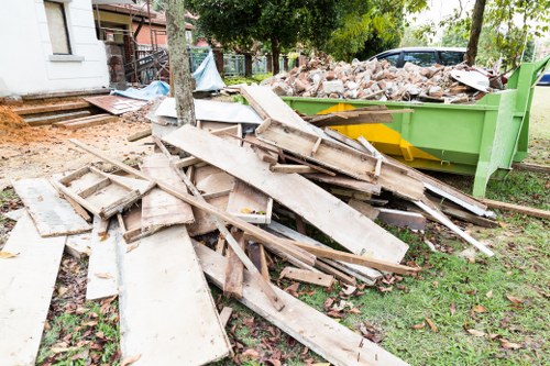 Professional rubbish removal service handling a sofa