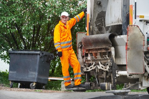 Professionals handling sofa removal waste responsibly